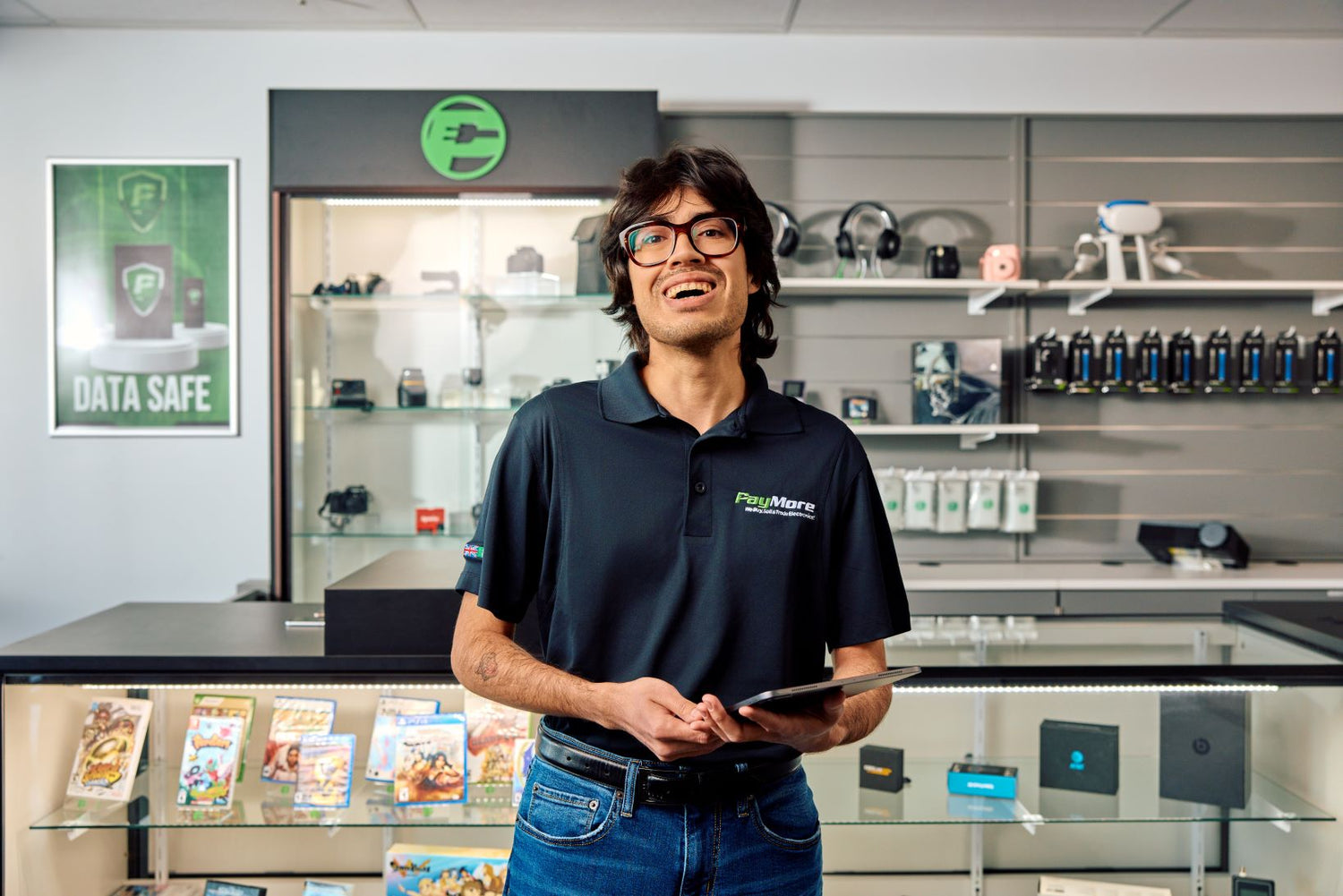 paymore employee holding a tablet and smiling